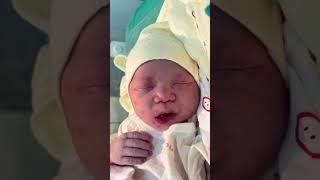 Oh my god, this chubby newborn is sticking out its tongue, so cute!