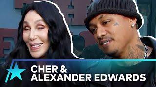 Cher Jokes Boyfriend Alexander Edwards STOLE Her Beanie For ‘Bikeriders’ Premiere