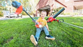 helping dad in the yard. Toy kids weed eater and real one