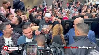 Shakira walks through hundreds of fans in New York.