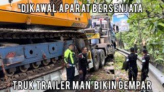 Dikawal Aparat Bersenjata, Truk Trailer MAN Muatan Super Panjang Bikin Gempar Sitinjau Lauik