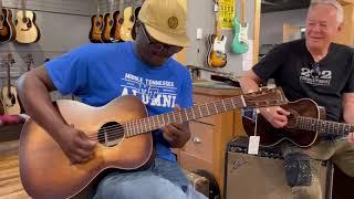 Tommy Emmanuel and Sean McDonald jamming at Guitar shop (Baby what you want me to do) 