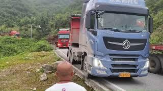 Dangerous truck driving.Crazy overloaded trucks.Truck turning on narrow road.