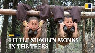 Young Chinese Shaolin monks display amazing feats of flexibility