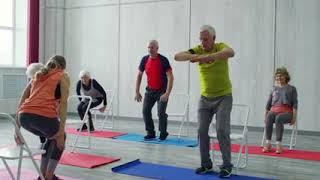 A Man Assisting A Woman In Using The Flat Pulldown Weights Equipment In A Gym · Free Stock Video