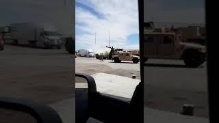 Army Hum V on fire near fuel pumps in lowa.