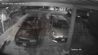 Bold face bandits: Suspect shifts camera upon noticing it.
