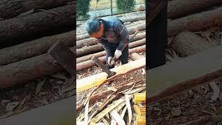 Chopping process of the outer layer of logs with an axe
