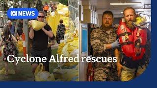 A rush on sandbags and a dramatic rescue at sea as Cyclone Alfred approaches | ABC NEWS