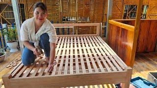 Girl makes wooden bed, daily life on the lake.