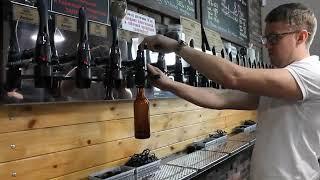 iTap Boel Filling a glass bottle with craft beer