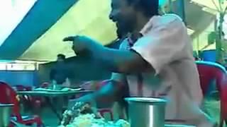 A indian man eating food