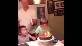 Look at this little maniac  the paper plate stopping him blowing the candles out kills me 