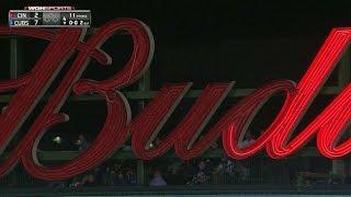 CIN@CHC: Schwarber breaks a sign during BP at Wrigley