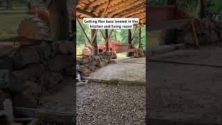 Crushed limestone flex base is getting leveled in the kitchen and living room! #naturalbuilding