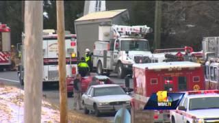 Box truck hits house after colliding with car