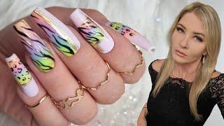 Rainbow ombre nails with animal print and transfer foil. Gel Polish gradient nail art using sponge