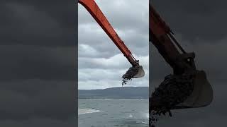 Long reach Hitachi EX1200 creating a new breakwater in Ireland