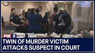 Twin of murder victim attacks suspect in court after seeing evidence video