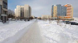 Walking around the town of Koltsovo near Novosibirsk on a warm winter day