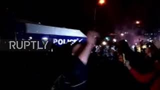 Georgia police disperse protesters with water cannons!