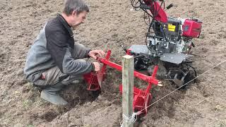 First crooked furrows in the new garden with motoblock