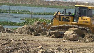 Good Heavy Bulldozer Pushing Gravel Rock with Dump Truck Unloading Working in Action Building Road