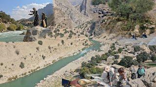 "IRANIAN NOMADIC"rudbal family fishing in a recreational mountain river next to a beautiful spring