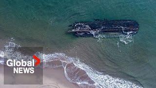 Century-old wooden ship buried at Nova Scotia beach uncovered by heavy rains