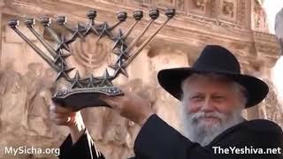 Rabbis Levi and Gershon Mendel Garelik at the arch of Titus, protest the fake menorah there