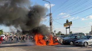 Burning wreckage after Israeli strike kills Hamas official in Lebanon | AFP