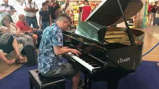 Playing piano in a Roman Airport [Kyle Landry]