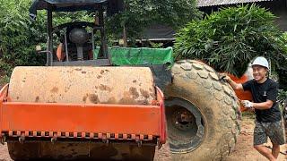 Drive over muddy road to fix giant tire for construction machine in deep mountain Giang repair car