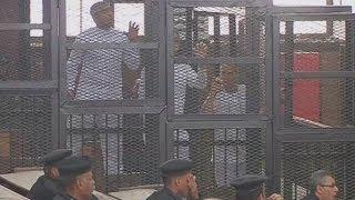 Behind Bars: Three Al Jazeera journalists jailed for seven years