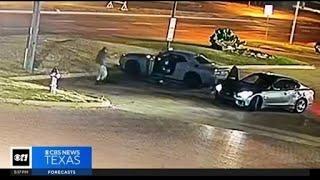 Dallas police release video of officer getting carjacked, shot