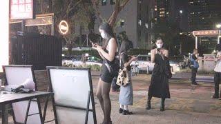 Street scene in Futian, Shenzhen, China, beautiful women on the side of the road