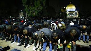 Palestinian Muslims perform Fajr prayer in the courtyard of Al Aqsa Mosque