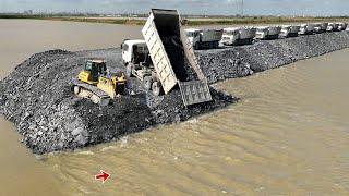 Incredible action of Dumping Rock Into Deep Water by Dump Trucks and Strong Dozer