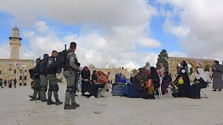 women are gathered at the closest point they can reach after being prevented from entering Al-AQSA