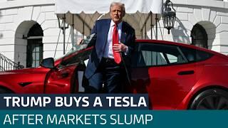 Trump buys a Tesla amid market turmoil, as he flip-flops on new tariffs against Canada | ITV News