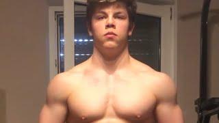 15 years old teen boy flexing muscles