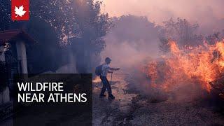 Athens wildfire reaches suburbs forcing hundreds to evacuate