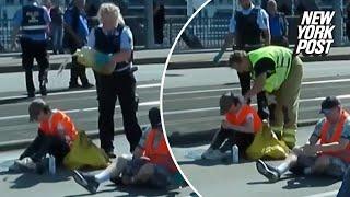 Cop accused of dumping oil on climate protester blocking road