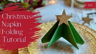 Create a STUNNING Christmas Tablescape with this easy Xmas Tree Napkin Fold!