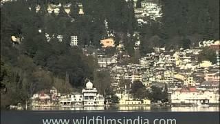 View of Naini Lake in the backdrop of Nainital city, Uttarakhand