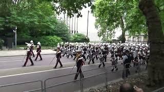 Massed Bands of HM Royal Marines marching to Horse Guards Parade for Beating Retreat 2024