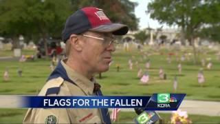 Dozens place flags near veterans final resting place in Lodi