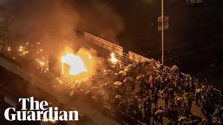 Hong Kong protesters set bridge on fire amid clashes at university