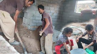 Mustafa smoothed the floor of the house and fixed the walls of the kitchen