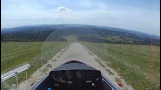 Sailplane does a gravity take off from top of a hill